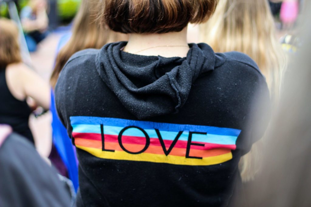 Woman wearing jumper saying love