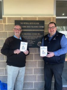 Lion Chris Russack of Angaston & District Club, is seen here presenting his newly released poetry book ‘The Angastonic’ to Hearing Dogs CEO David Horne